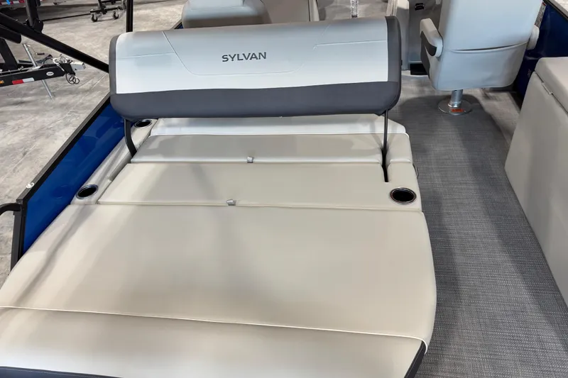 Slide: The Image of 2026 Sylvan X 5 boat interior with cushioned seating and cup holders. - 14
