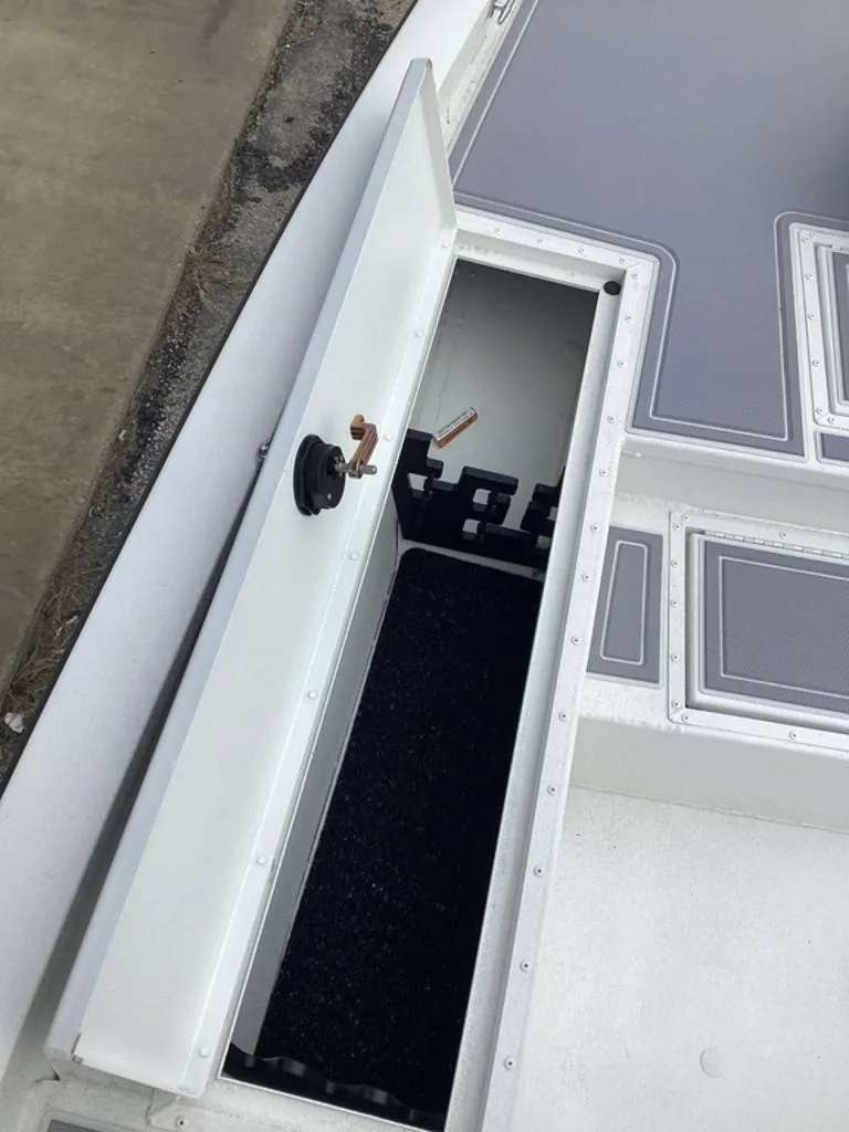 Slide: The Image of Open storage compartment on a 2025 G3 Bay 21 GX boat. - 27
