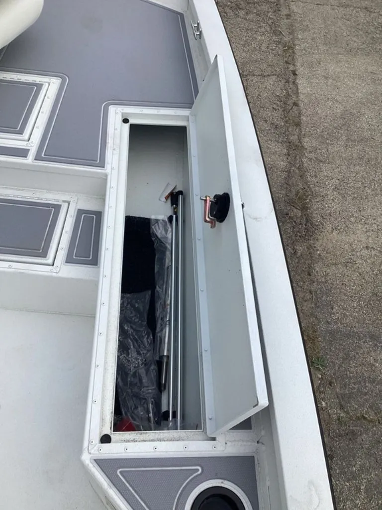 Slide: The Image of Open storage compartment on a 2025 G3 Bay 21 GX boat. - 29
