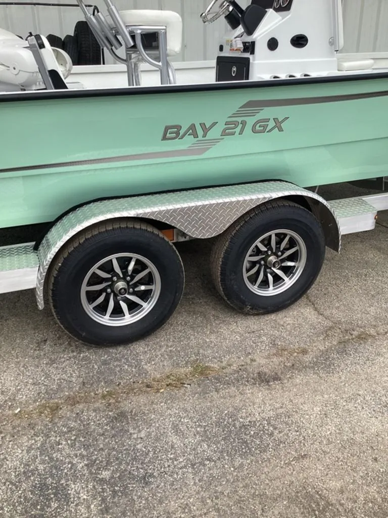 Slide: The Image of 2025 G3 Bay 21 GX boat on trailer with dual wheels. - 35
