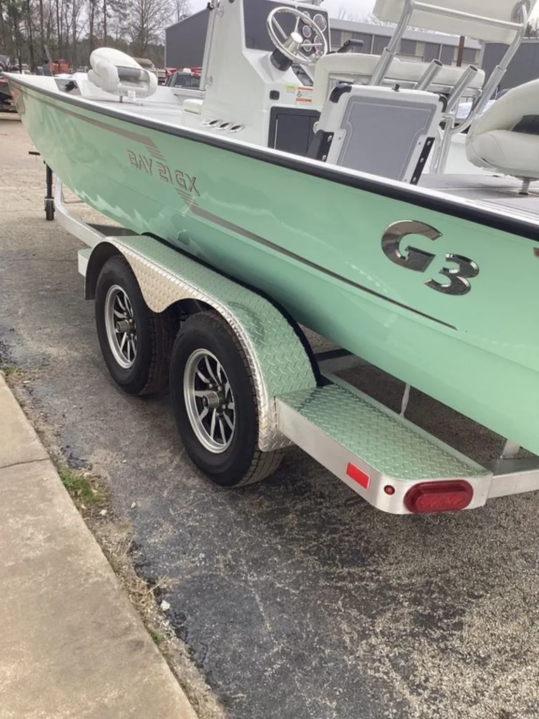 Slide: The Image of 2025 G3 Bay 21 GX boat on trailer, side view. - 39
