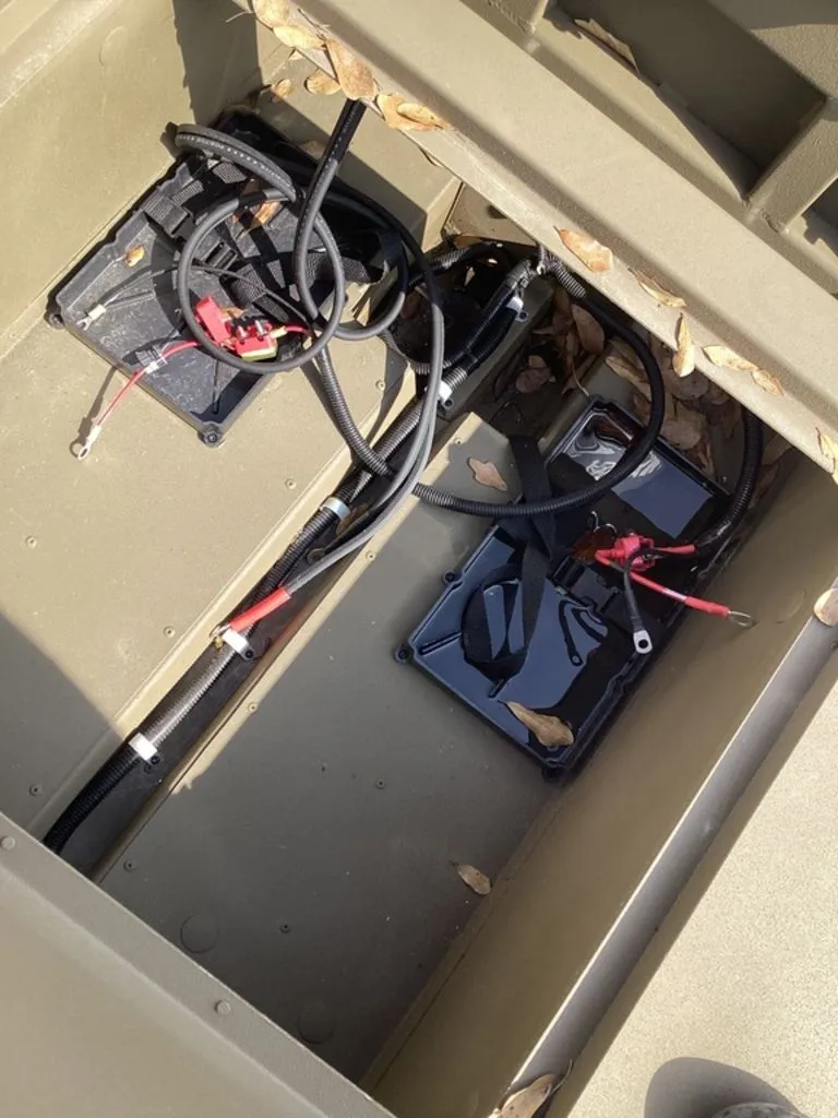 Slide: The Image of Interior of G3 Gator Tough 16 DK boat, visible batteries and cables. - 21