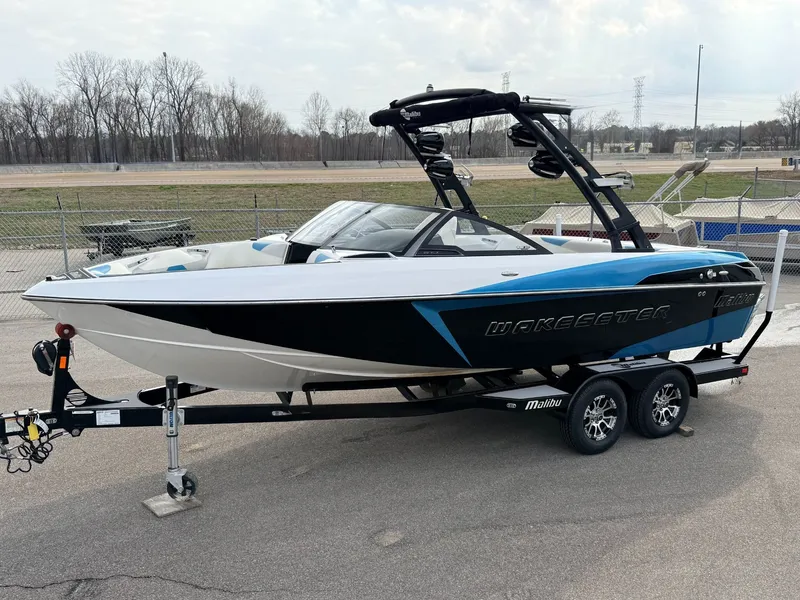 Slide: The Image of 2016 Malibu Wakesetter 22 VLX on trailer, blue and black. - 1