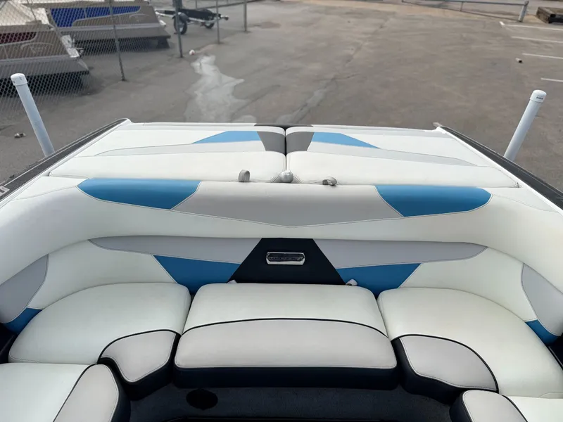 Slide: The Image of Interior of 2016 Malibu Wakesetter 22 VLX boat, white and blue upholstery. - 11