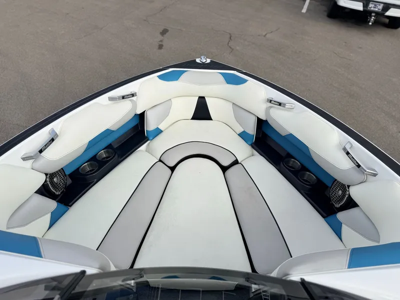 Slide: The Image of Interior of 2016 Malibu Wakesetter 22 VLX with blue and white seating. - 4