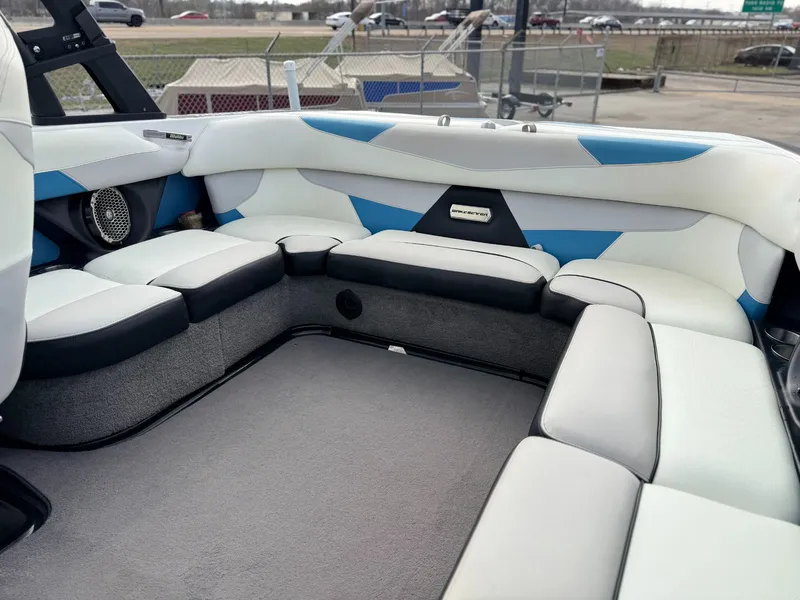 Slide: The Image of Interior of 2016 Malibu Wakesetter 22 VLX with white and blue seating. - 9