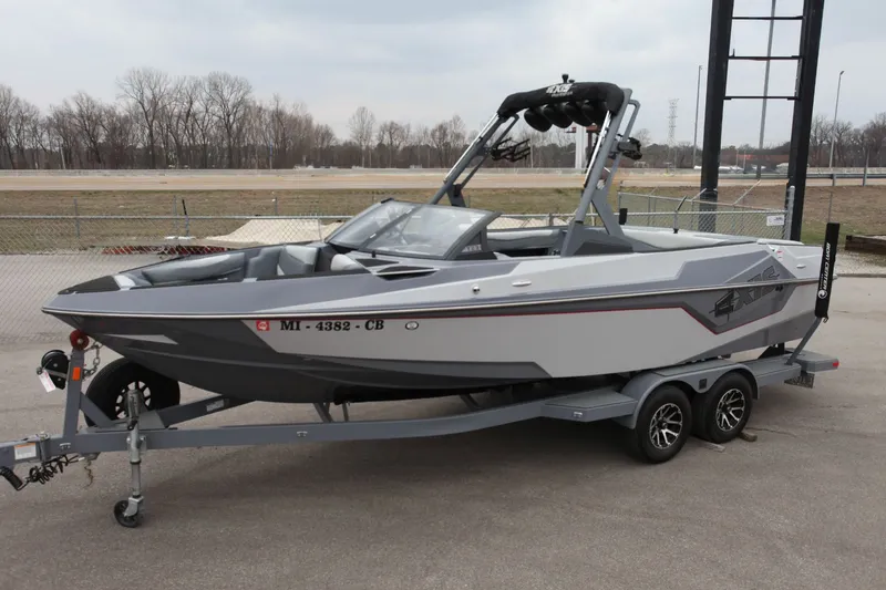 Slide: The Image of 2021 Axis T23 boat on trailer, gray color. - 1