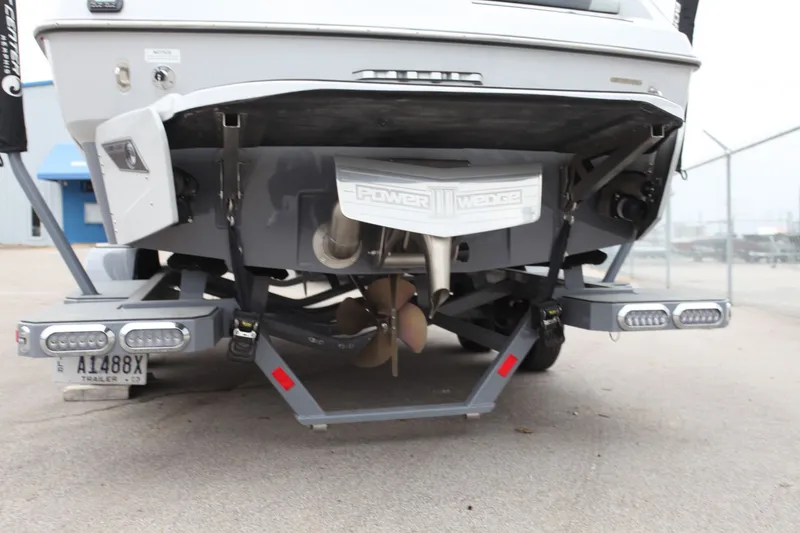 Slide: The Image of Rear view of a 2021 Axis T23 boat on a trailer. - 8