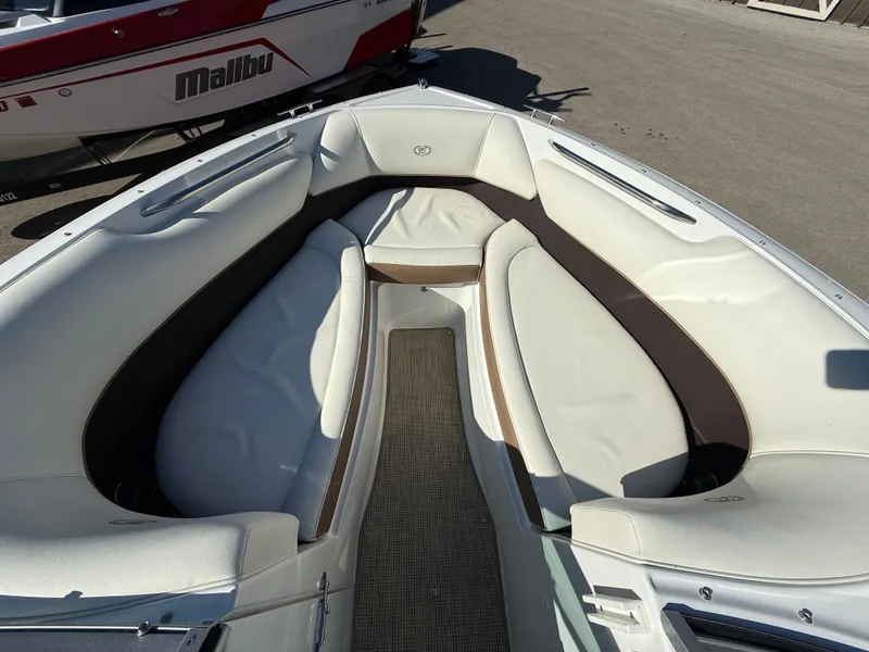 Slide: The Image of Interior of a 2015 Cobalt 220S boat with white upholstery. - 26