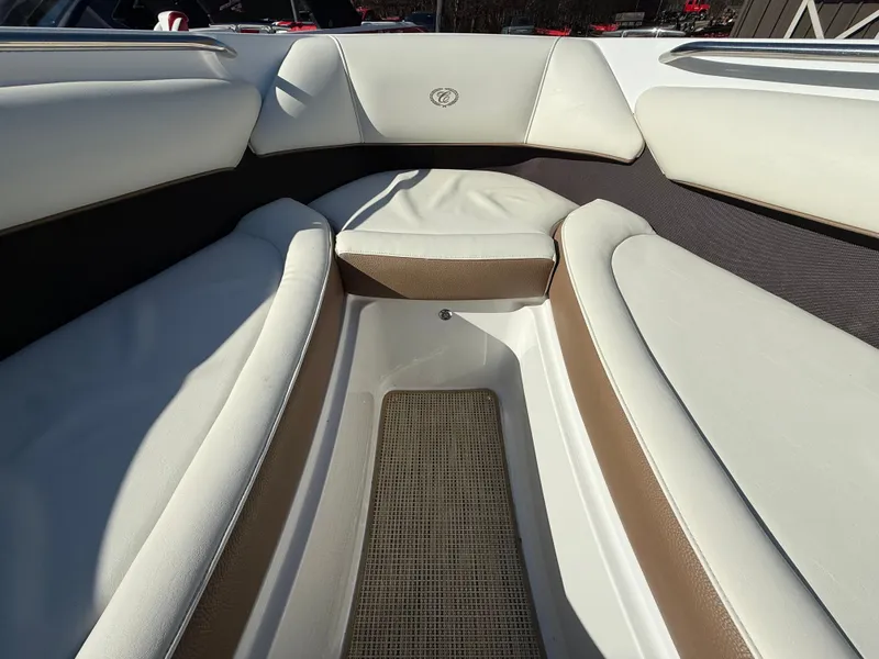 Slide: The Image of Interior of a 2015 Cobalt 220S boat with beige and white seating. - 28