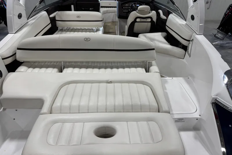 Slide: The Image of Interior of a 2015 Cobalt R5 boat with white leather seating. - 6