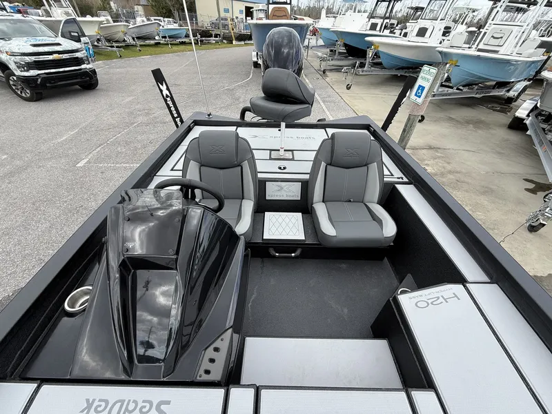 Slide: The Image of Xpress Hyper-Lift Bass Series H20 boat, 2026 model, on a parking lot. - 5