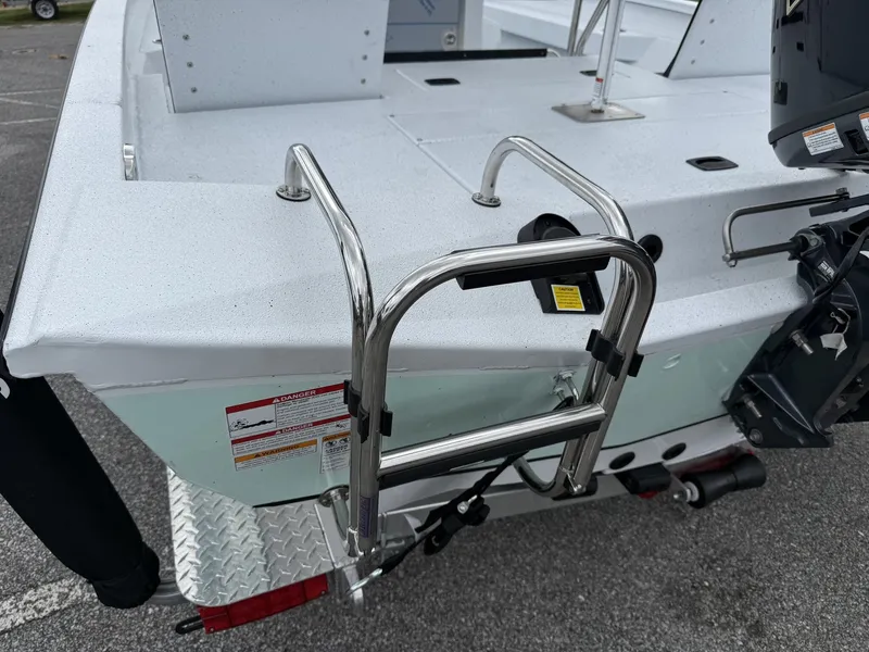 Slide: The Image of 2026 Xpress H20B Bay boat with stainless steel ladder. - 4