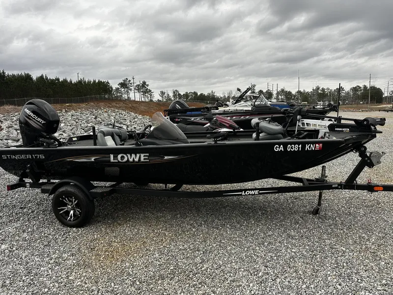 Slide: The Image of 2016 Lowe Stinger ST175 boat with addons on trailer. - 1