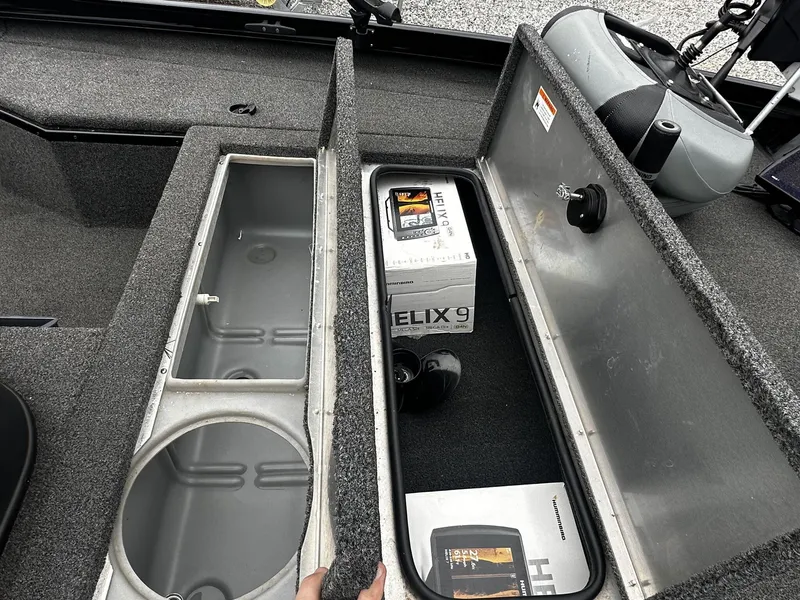 Slide: The Image of 2016 Lowe Stinger ST175 with storage compartments and Helix 9 fish finder. - 11