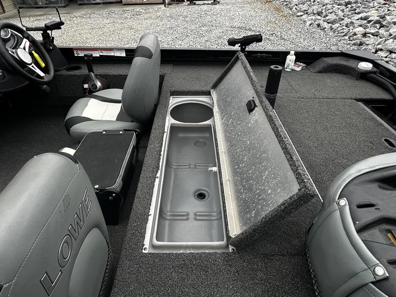 Slide: The Image of Interior of a 2016 Lowe Stinger ST175 boat with storage compartment. - 12