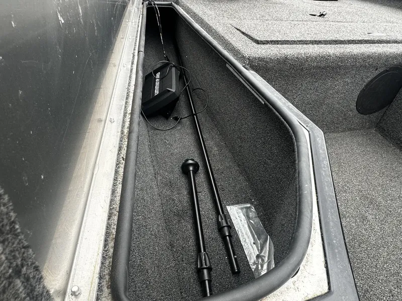 Slide: The Image of Interior view of a 2016 Lowe Stinger ST175 boat storage compartment. - 13