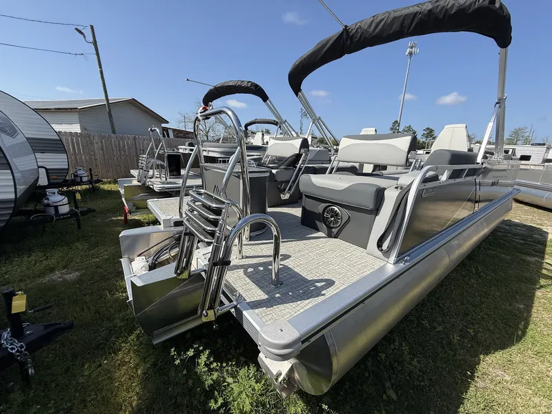 Slide: The Image of 2026 Avalon LSZ 25 Quad Lounger-Tritoon boat parked on grass. - 6