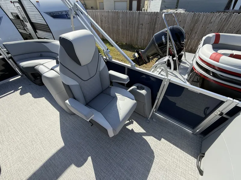 Slide: The Image of 2026 Avalon LSZ 23 Quad Lounger with gray seating and Yamaha motor. - 8