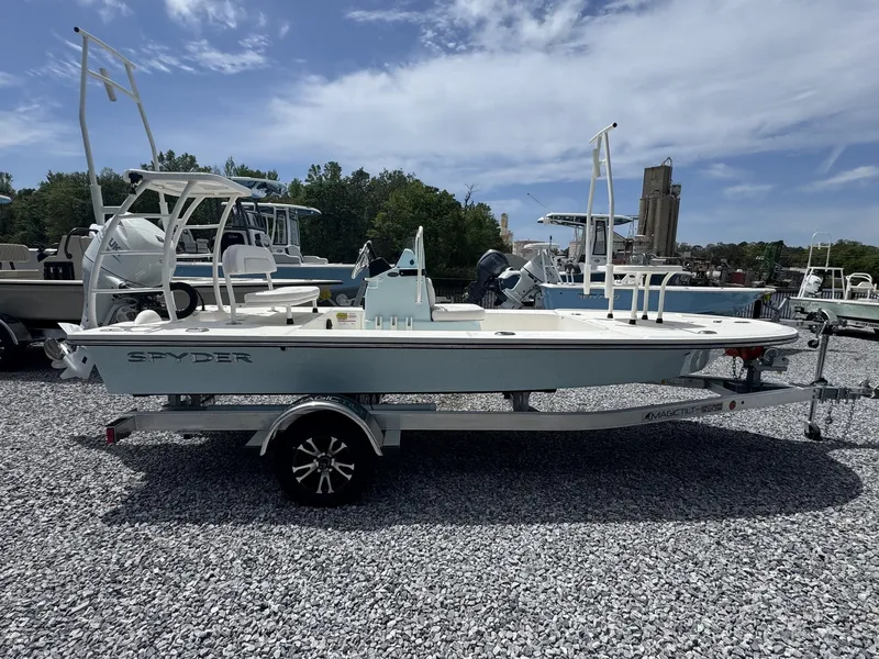 The Image of 2026 Spyder FX17 Flicker boat on gravel lot under sunny sky. - 1