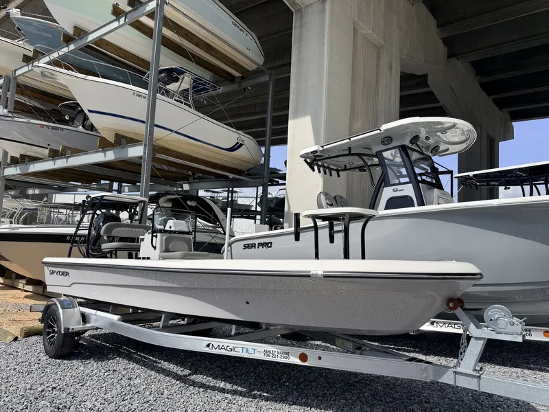 Slide: The Image of 2026 Spyder FX19 Vapor boat on trailer at marina. - 1