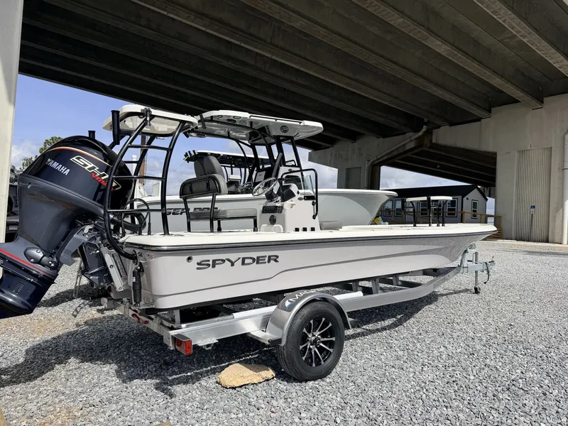 Slide: The Image of 2026 Spyder FX19 Vapor boat parked under bridge. - 10