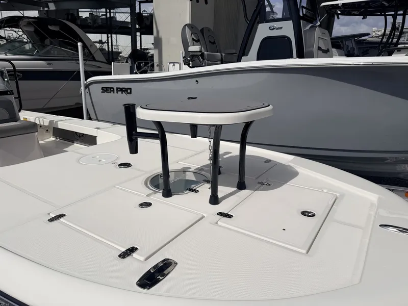 Slide: The Image of 2026 Spyder FX19 Vapor boat deck with table. - 2