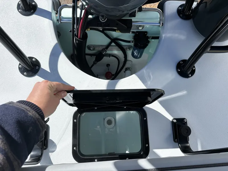 Slide: The Image of Delta Boatworks D18 CC 2026, open compartment and engine view. - 10