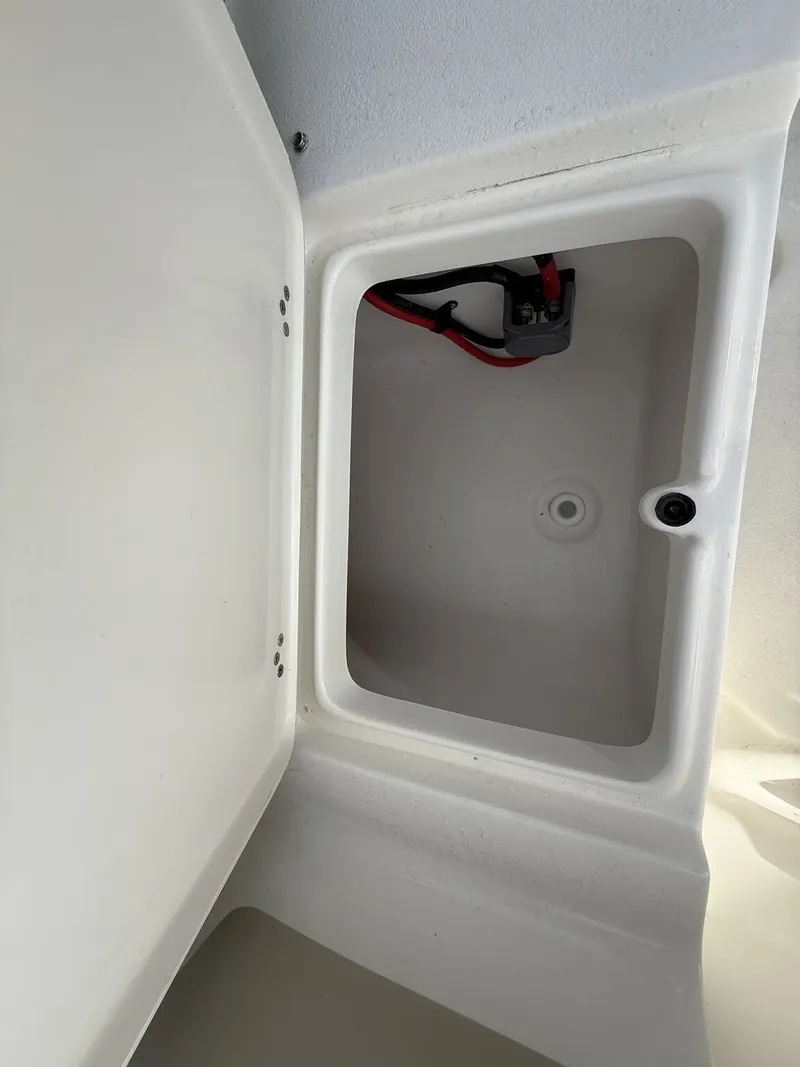 Slide: The Image of Interior view of 2026 Key West 219 FS boat storage compartment. - 12