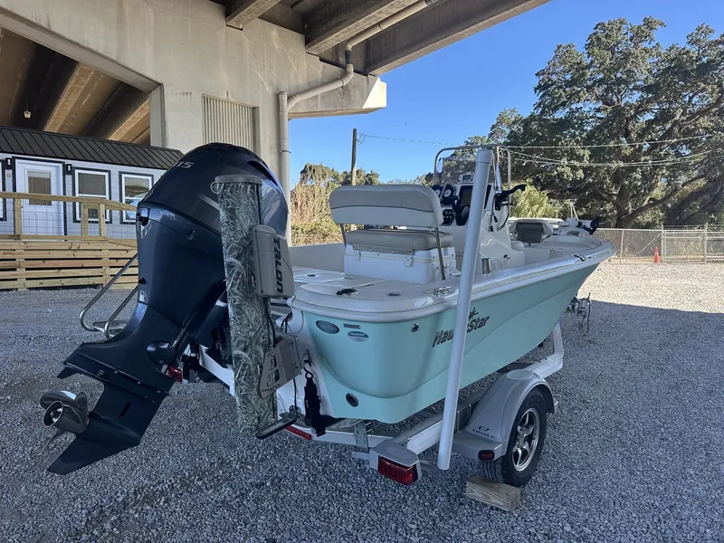 Slide: The Image of 2018 NauticStar 1810 NauticBay boat parked under bridge. - 3