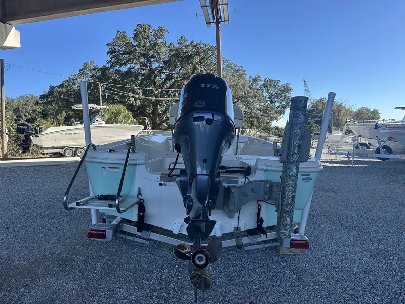 Slide: The Image of 2018 NauticStar 1810 NauticBay with outboard motor outdoors. - 4