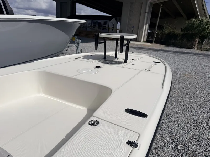 Slide: The Image of 2026 Spyder FX19 Vapor boat on gravel lot under bridge. - 4