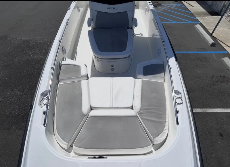 Slide: The Image of 2016 Boston Whaler 270 Dauntless with gray cushions on deck. - 15