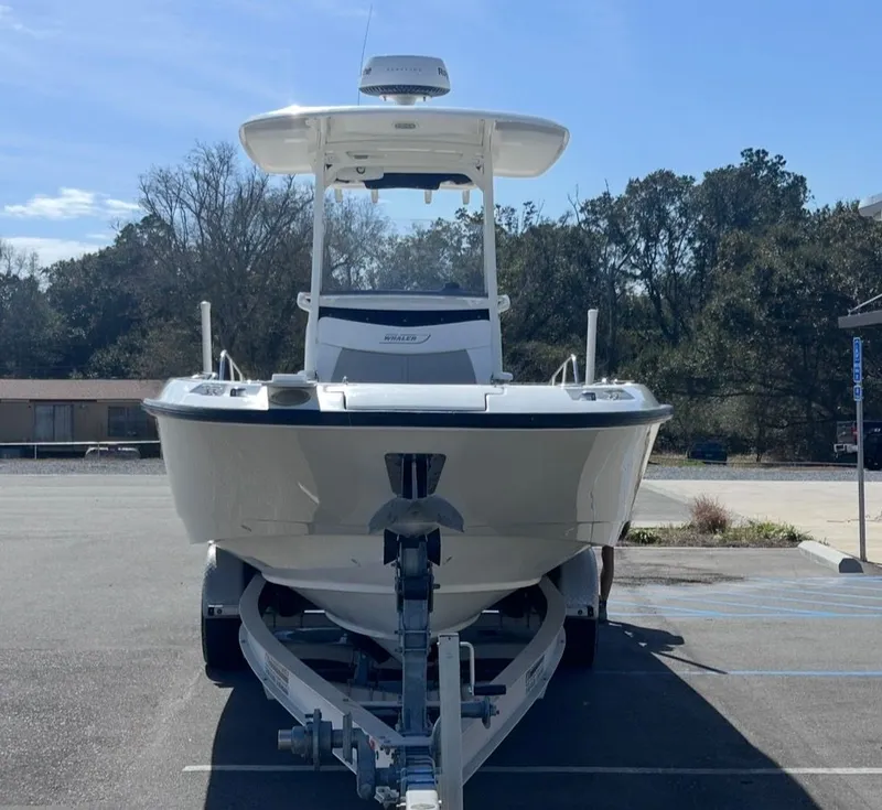 Slide: The Image of 2016 Boston Whaler 270 Dauntless boat on trailer outdoors. - 8