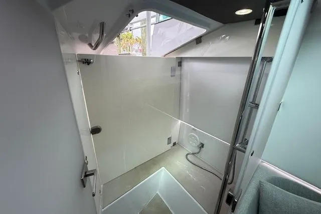 Slide: The Image of 2024 Axopar 37 Sun-Top interior cabin with modern design and sleek finishes. - 17