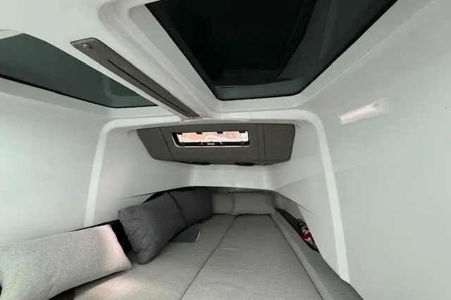 Slide: The Image of Interior cabin of 2024 Axopar 37 Sun-Top with skylights and gray seating. - 20