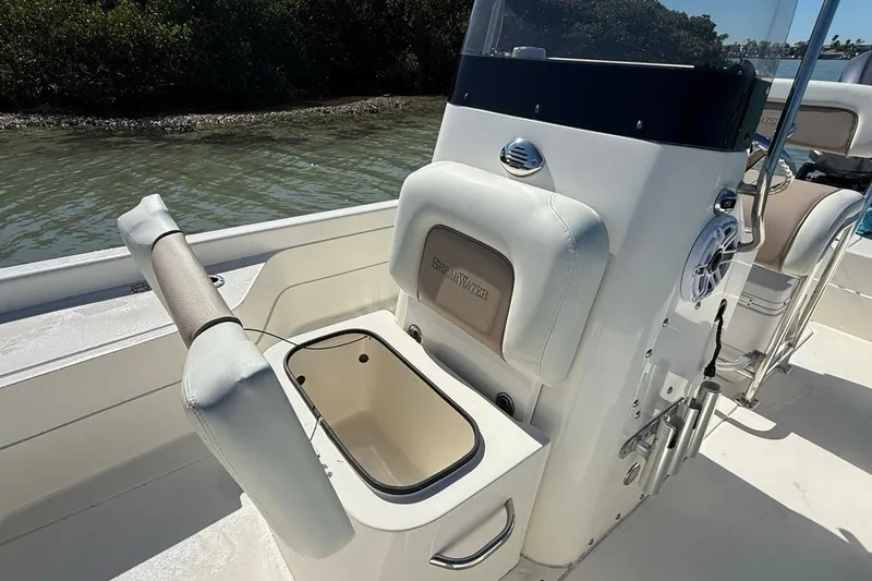 Slide: The Image of 2012 ShearWater 25 LTZ boat interior with seating and storage compartment. - 19