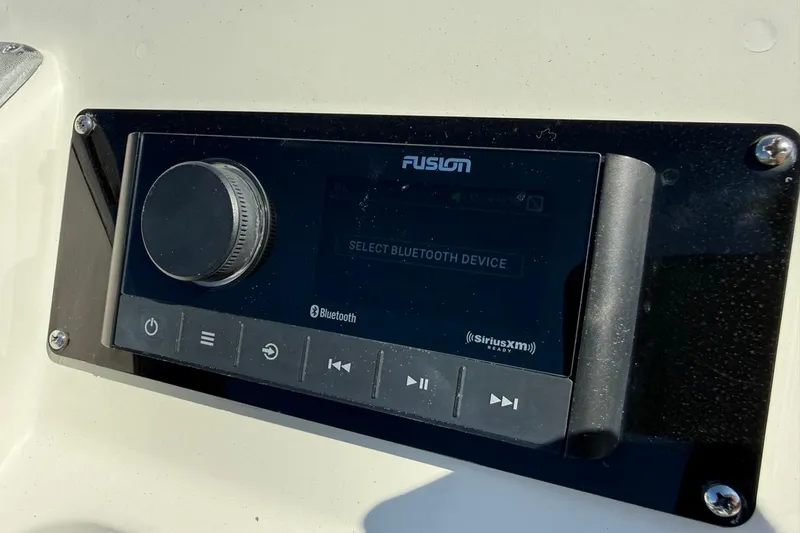 Slide: The Image of Fusion audio system on 2012 ShearWater 25 LTZ boat, featuring Bluetooth and SiriusXM capabilities. - 23