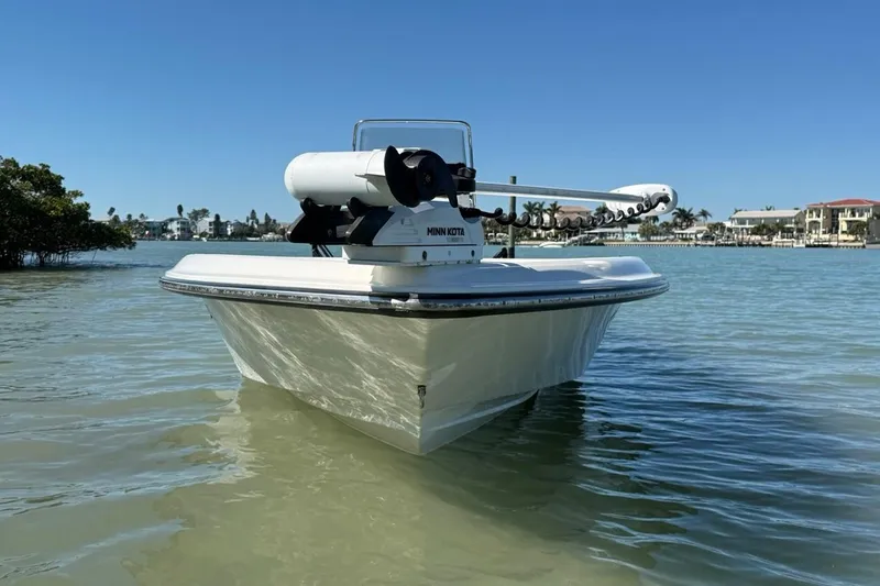 Slide: The Image of 2012 ShearWater 25 LTZ boat on calm water, clear blue sky background. - 3