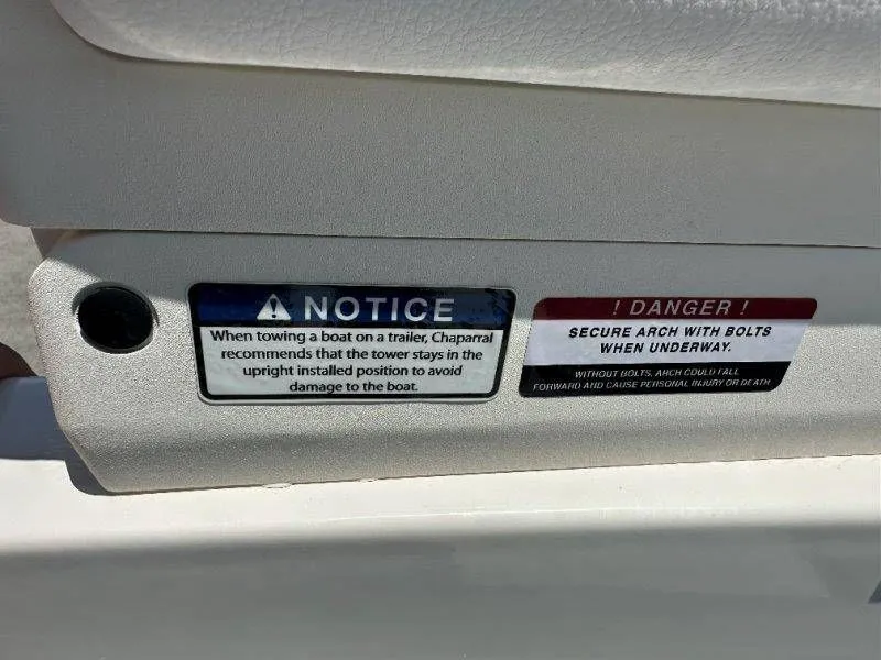 Slide: The Image of Warning labels on a 2026 Chaparral 21 SSi boat. - 16