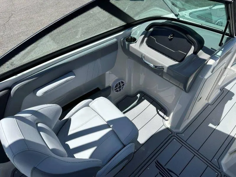 Slide: The Image of Interior of 2026 Chaparral 21 SSi with helm and seating. - 17