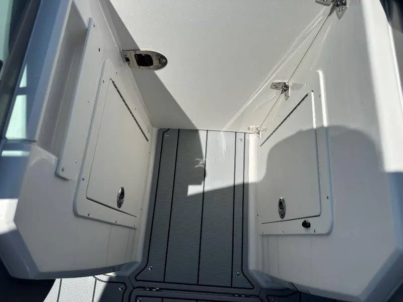 Slide: The Image of Interior of 2026 Chaparral 21 SSi with storage compartments. - 18