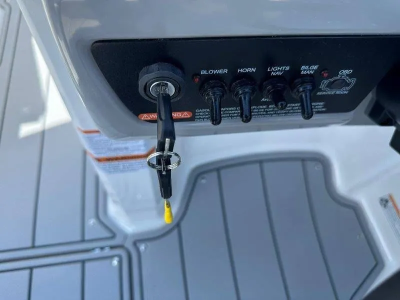 Slide: The Image of Dashboard of Chaparral 21 SSi 2026 with switches and ignition key. - 20