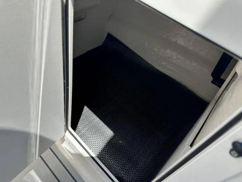 Slide: The Image of Interior of Chaparral 21 SSi 2026 boat, storage compartment view. - 22