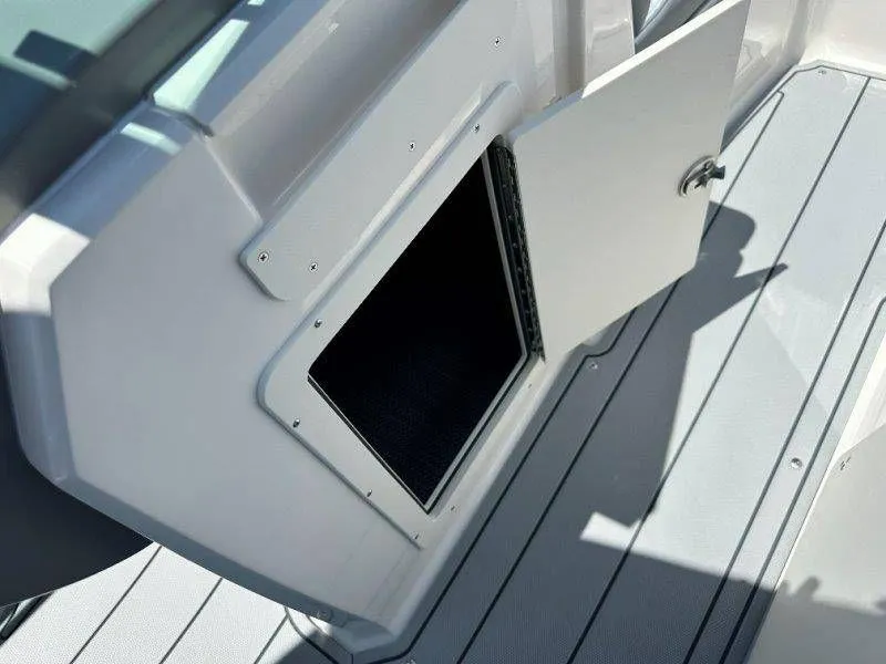 Slide: The Image of Storage compartment in Chaparral 21 SSi boat, year 2026. - 26