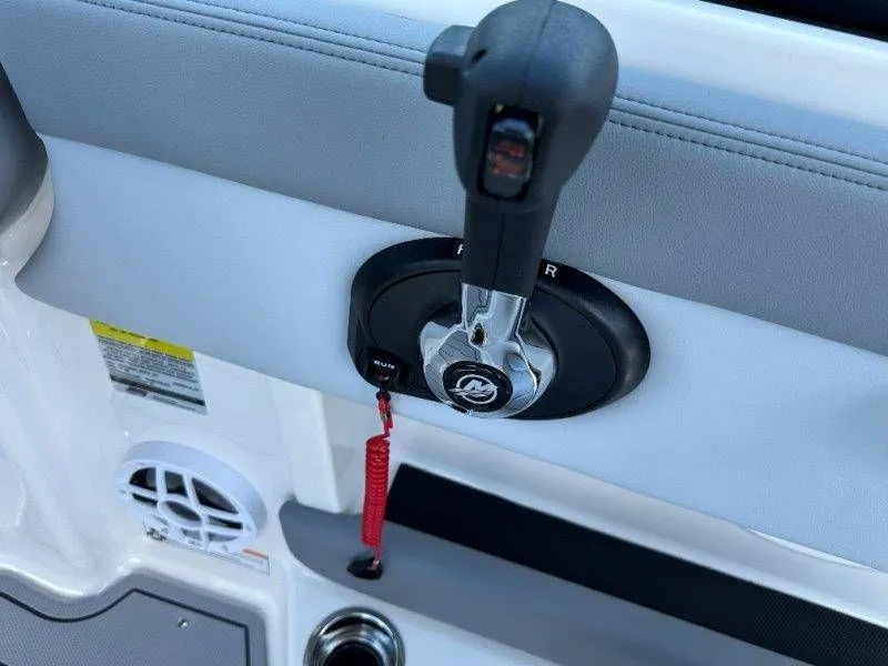 Slide: The Image of Close-up of throttle lever on a 2026 Chaparral 21 SSi boat. - 29