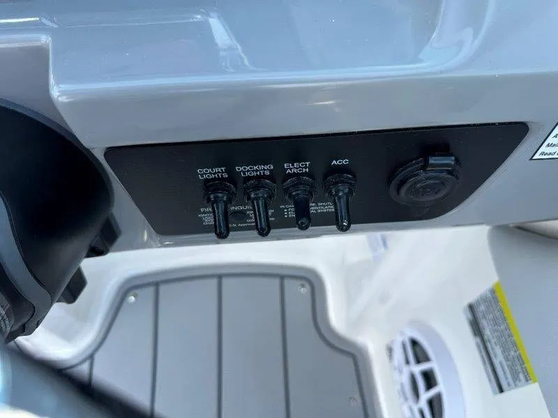 Slide: The Image of Control panel of 2026 Chaparral 21 SSi with light switches. - 30