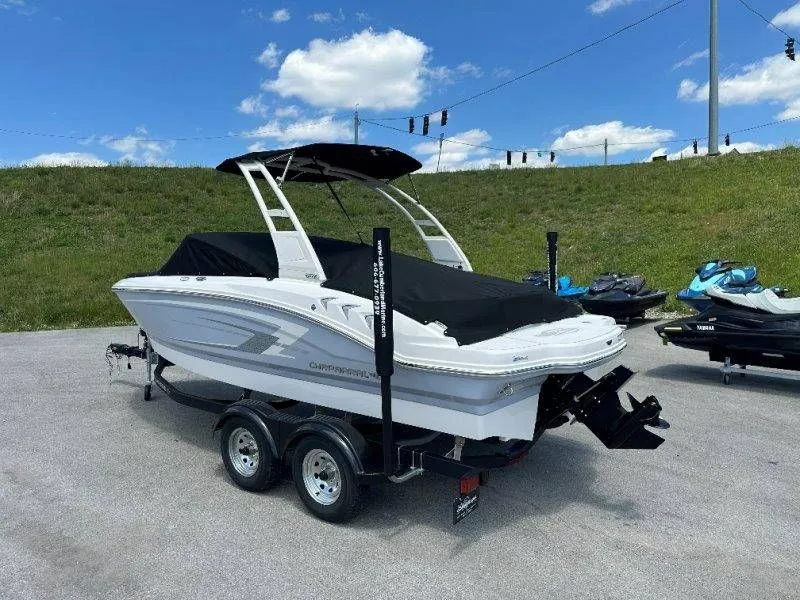 Slide: The Image of 2026 Chaparral 21 SSi boat on trailer, covered, outdoors. - 43
