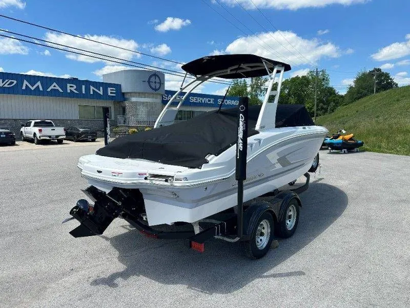 Slide: The Image of 2026 Chaparral 21 SSi boat on trailer outside marine shop. - 46