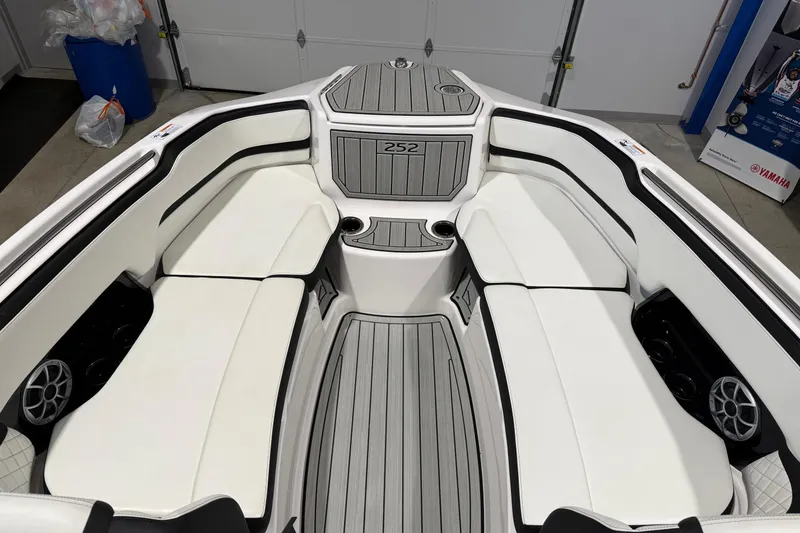 Slide: The Image of 2025 Yamaha Boats 252S interior with white seating and modern design. - 6